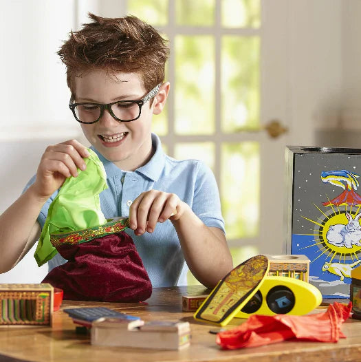 Boy playing with magician toys.